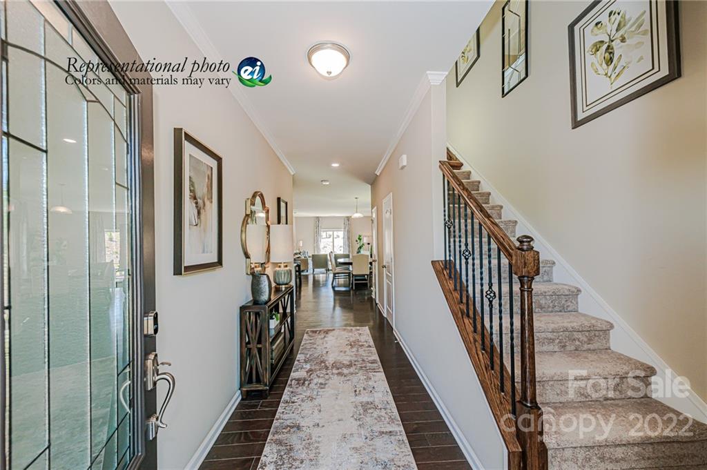 5790 Soft Shell Drive, Unit 277 Lancaster, SC 29720 - Photo 2 of 22 a view of a hallway with wooden floor
