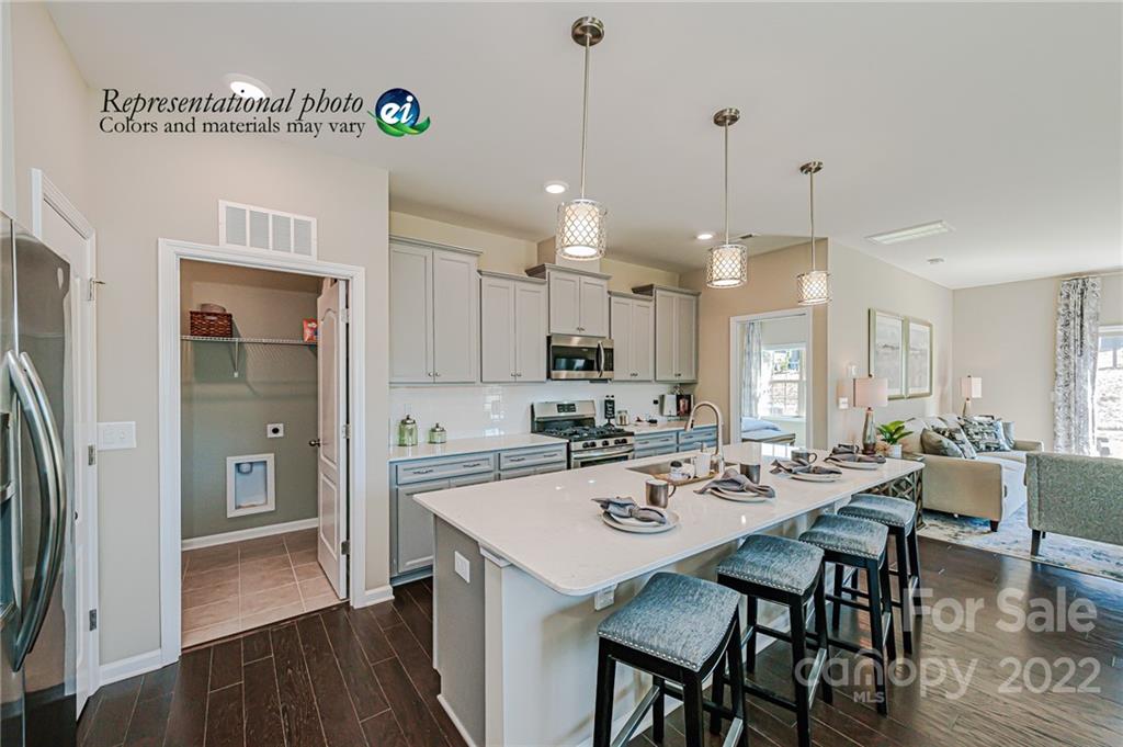 5790 Soft Shell Drive, Unit 277 Lancaster, SC 29720 - Photo 6 of 22 a view of a dining room and livingroom with furniture
