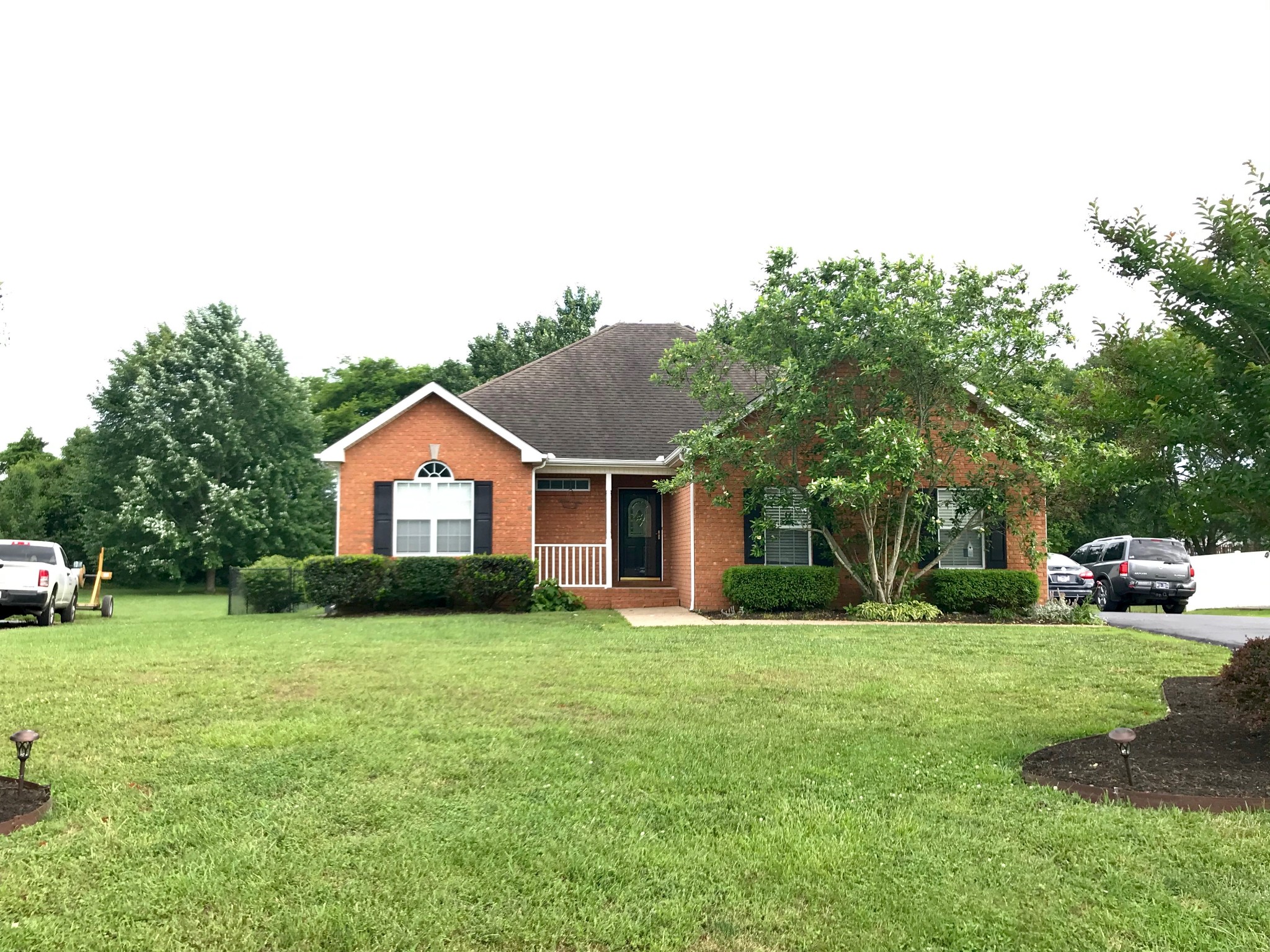 207 Towbridge Drive Murfreesboro, TN 37129 - Photo 1 of 31 a front view of a house with a yard and garage