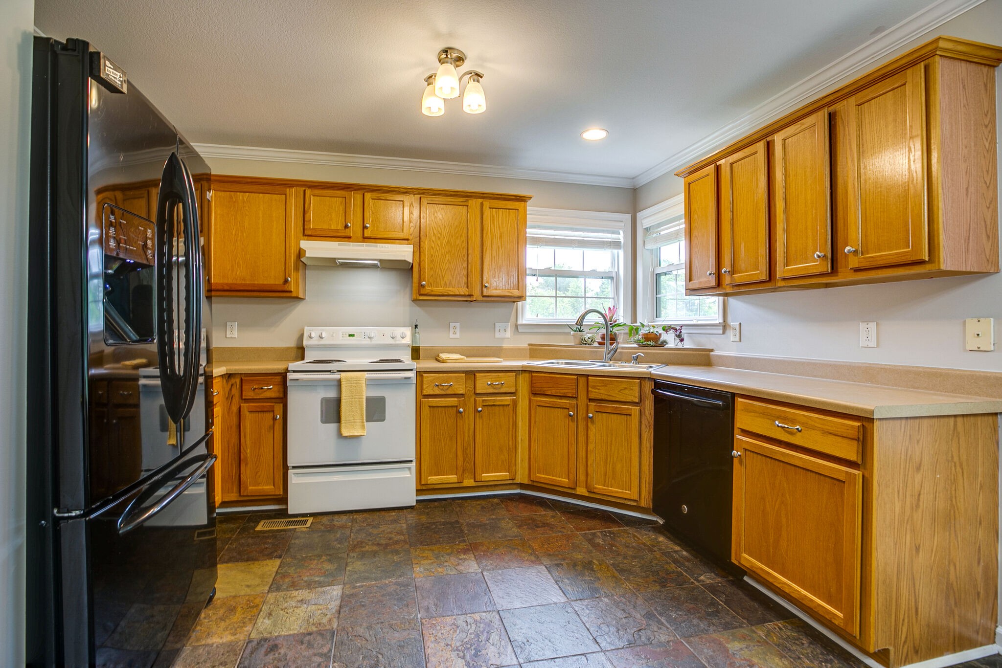 207 Towbridge Drive Murfreesboro, TN 37129 - Photo 12 of 31 a kitchen with a stove a sink and a refrigerator