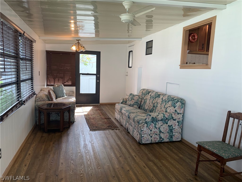 19681 Summerlin Road, Unit 195 Fort Myers, FL 33908 - Photo 2 of 12 a living room with furniture and a wooden floor