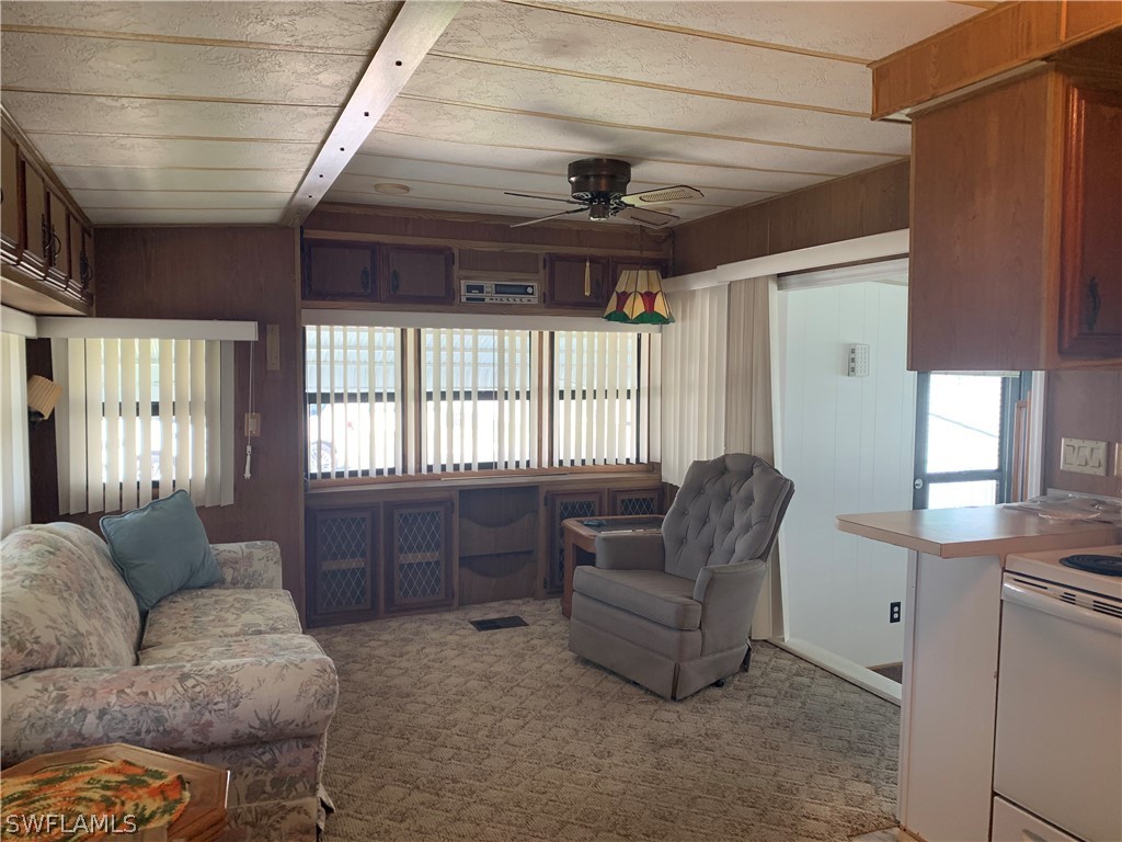 19681 Summerlin Road, Unit 195 Fort Myers, FL 33908 - Photo 7 of 12 a living room with furniture and a large window