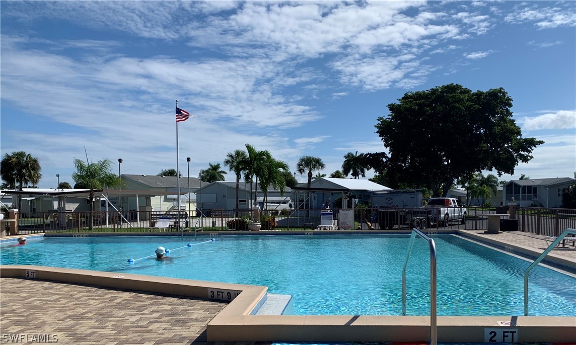 19681 Summerlin Road, Unit 195 Fort Myers, FL 33908 - Photo 10 of 12 a view of swimming pool with outdoor seating and plants