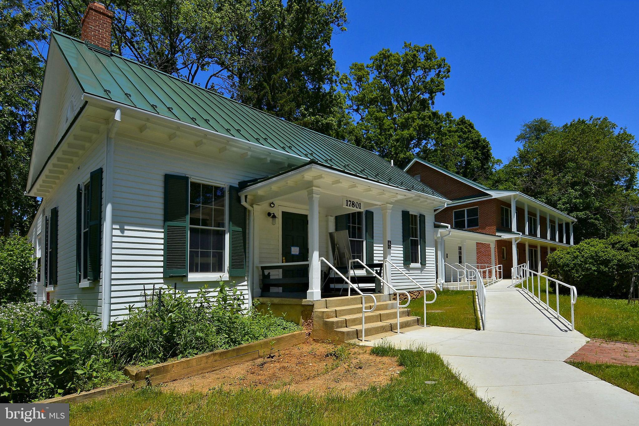 1049 Windrush Lane, Unit 2 Sandy Spring, MD 20860 - Photo 51 of 59 a view of a house with sitting area and garden
