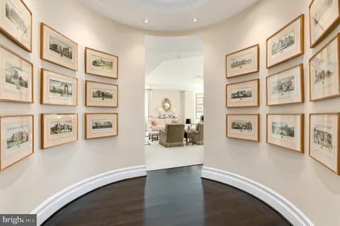 a living room with furniture large window and flat screen tv