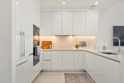 a kitchen with a sink and cabinets
