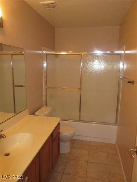 171 Enloe Street Henderson, NV 89074 - Photo 11 of 12 Full bathroom featuring vanity, bath / shower combo with glass door, and light tile patterned flooring