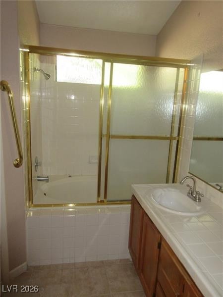 171 Enloe Street Henderson, NV 89074 - Photo 8 of 12 Full bath with vanity, tiled shower / bath, and light tile patterned floors