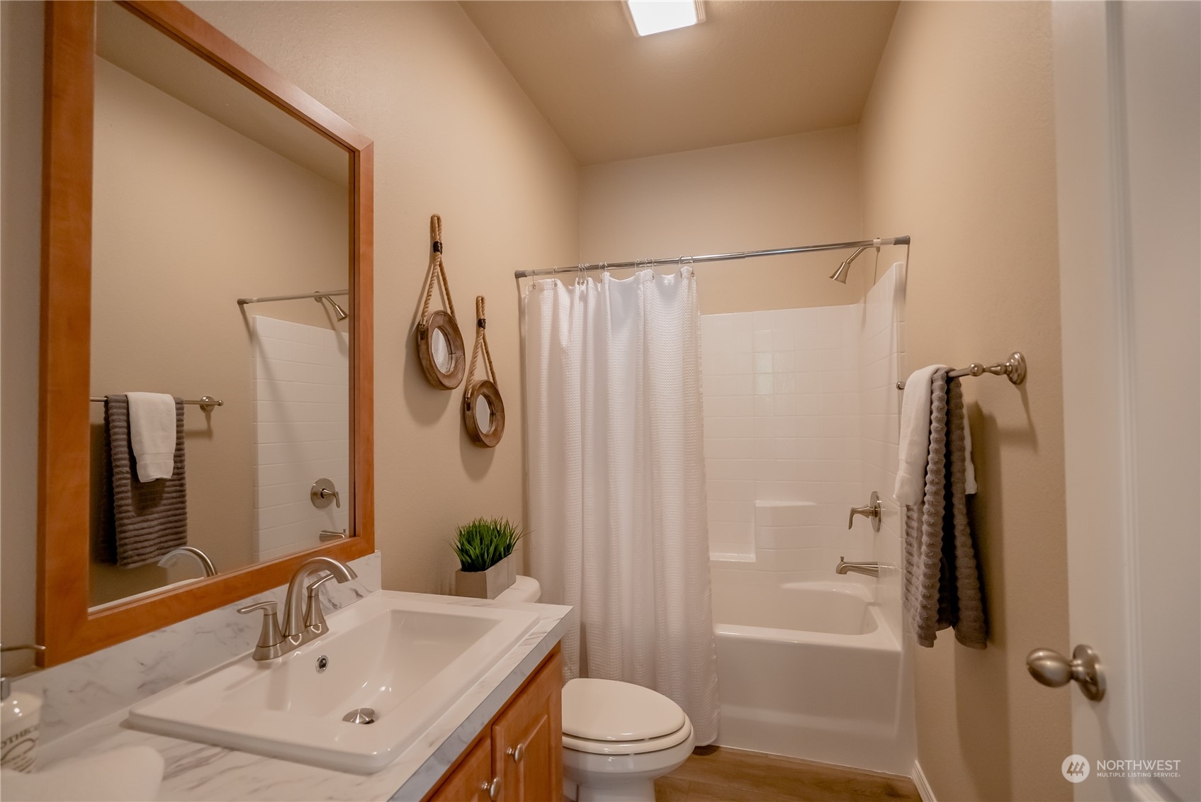 16819 Erickson Road Southwest Longbranch, WA 98351 - Photo 12 of 15 a bathroom with a sink toilet and shower