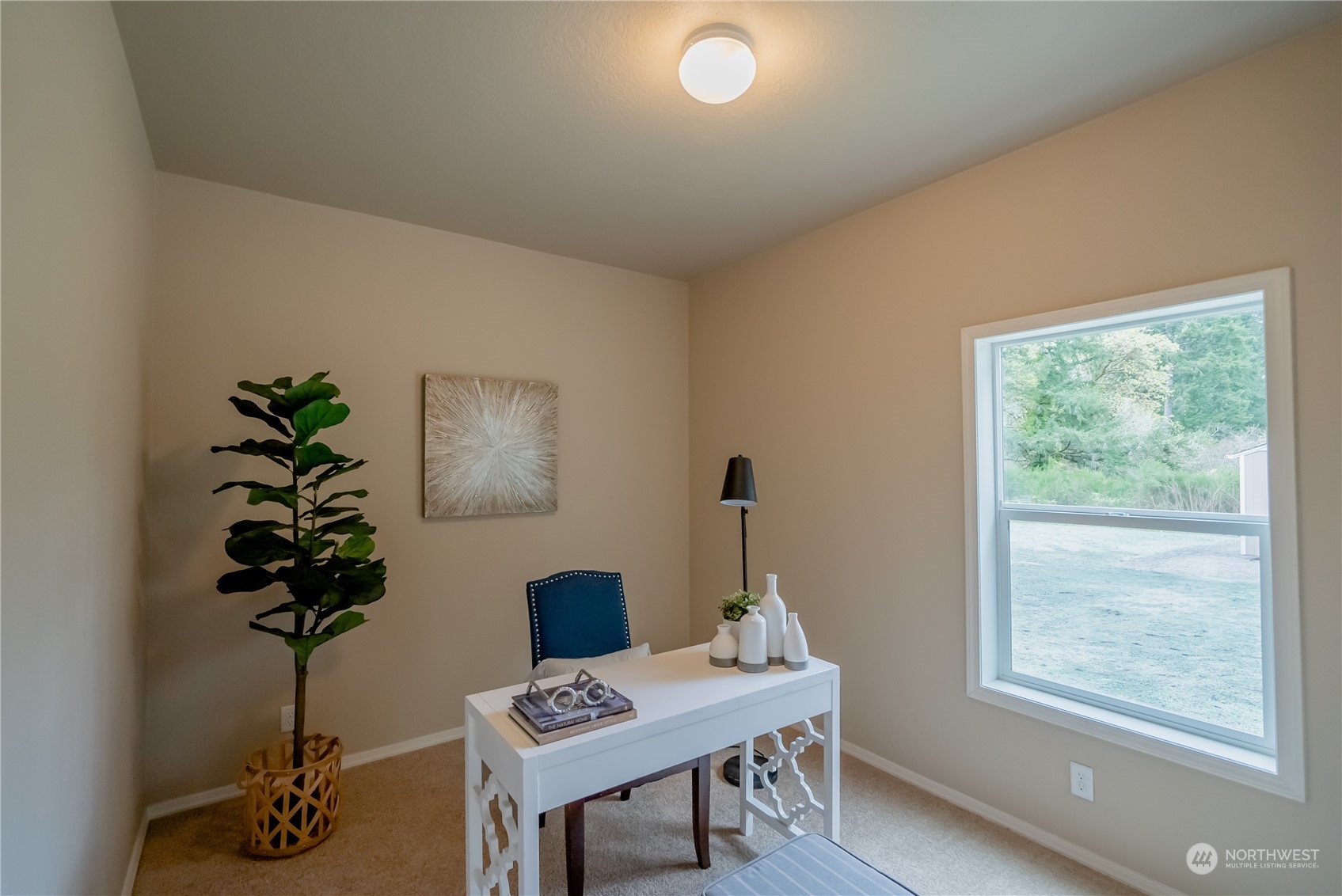 16819 Erickson Road Southwest Longbranch, WA 98351 - Photo 14 of 15 a workspace with furniture and a potted plant