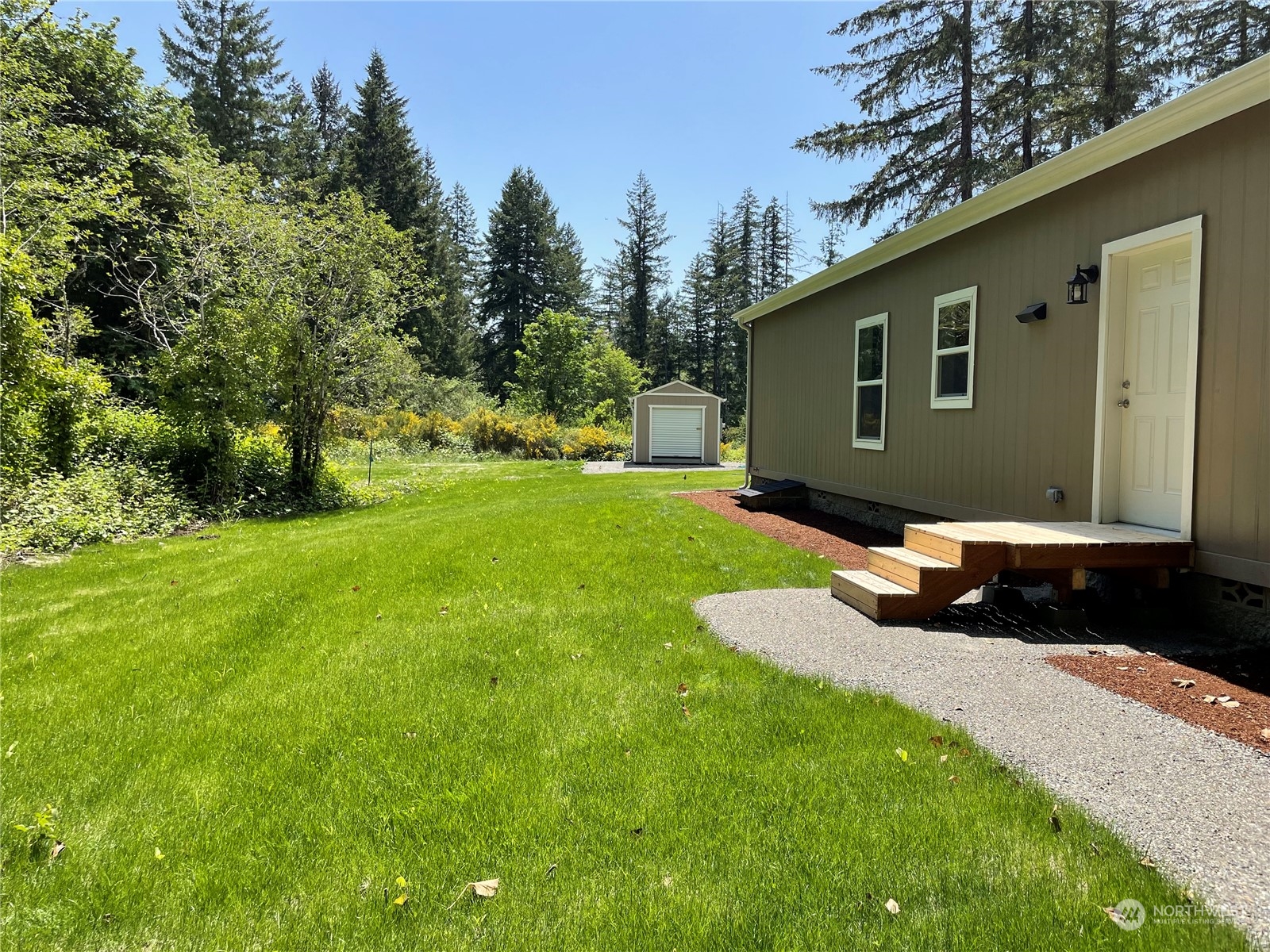 16819 Erickson Road Southwest Longbranch, WA 98351 - Photo 15 of 15 a front view of a house with a yard