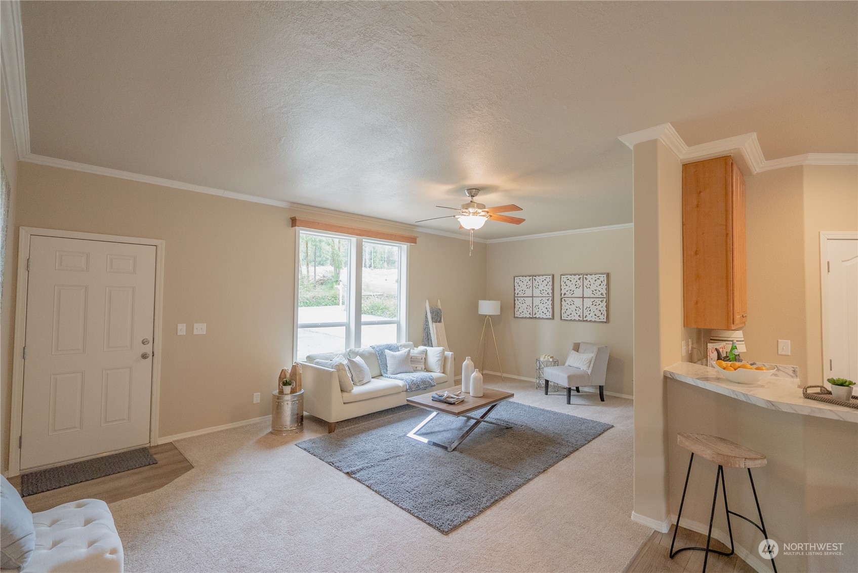 16819 Erickson Road Southwest Longbranch, WA 98351 - Photo 3 of 15 a living room with furniture and a large window
