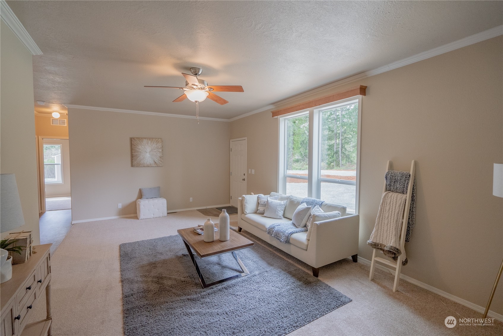 16819 Erickson Road Southwest Longbranch, WA 98351 - Photo 4 of 15 a living room with furniture and a large window