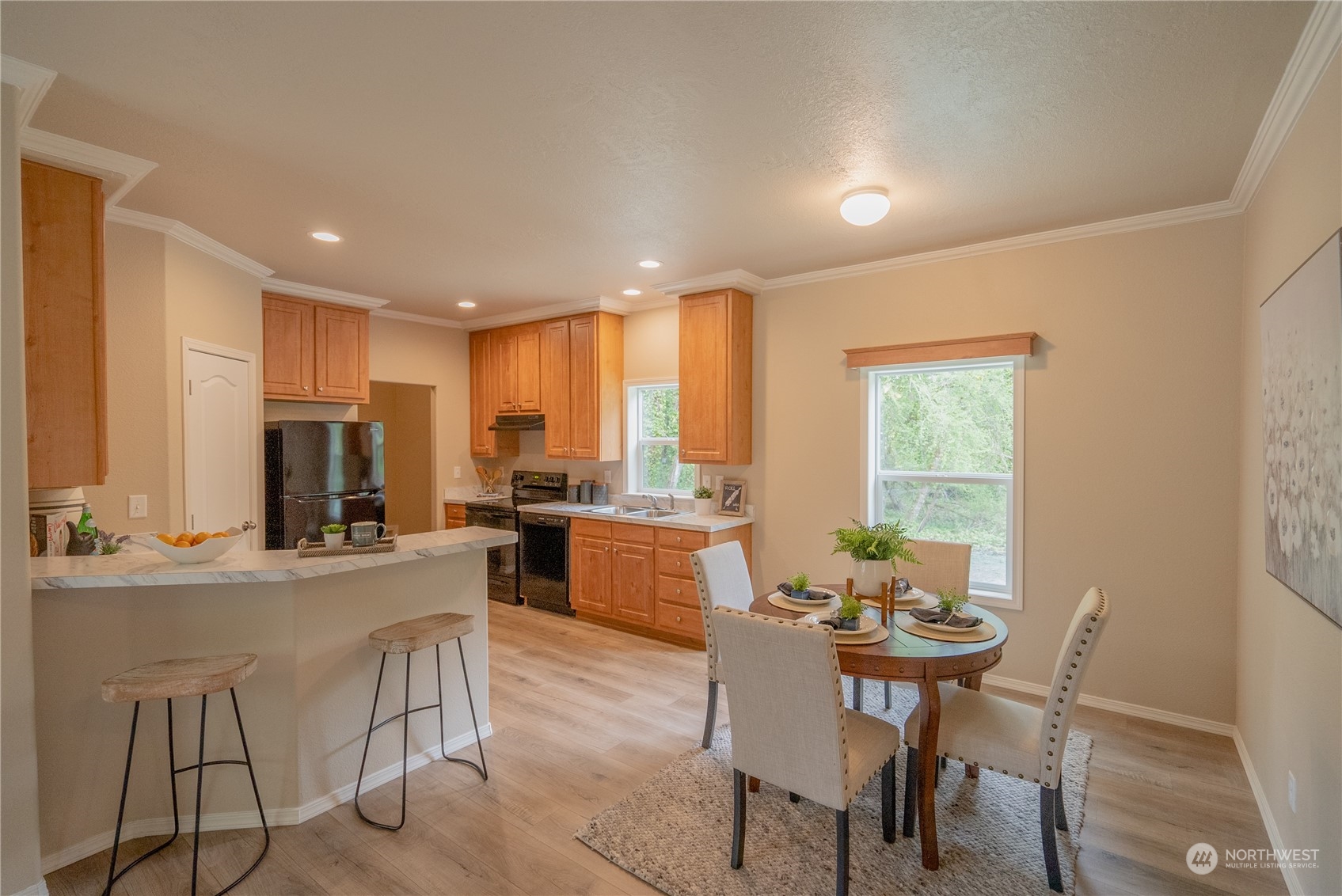 16819 Erickson Road Southwest Longbranch, WA 98351 - Photo 5 of 15 a kitchen with a table and chairs in it