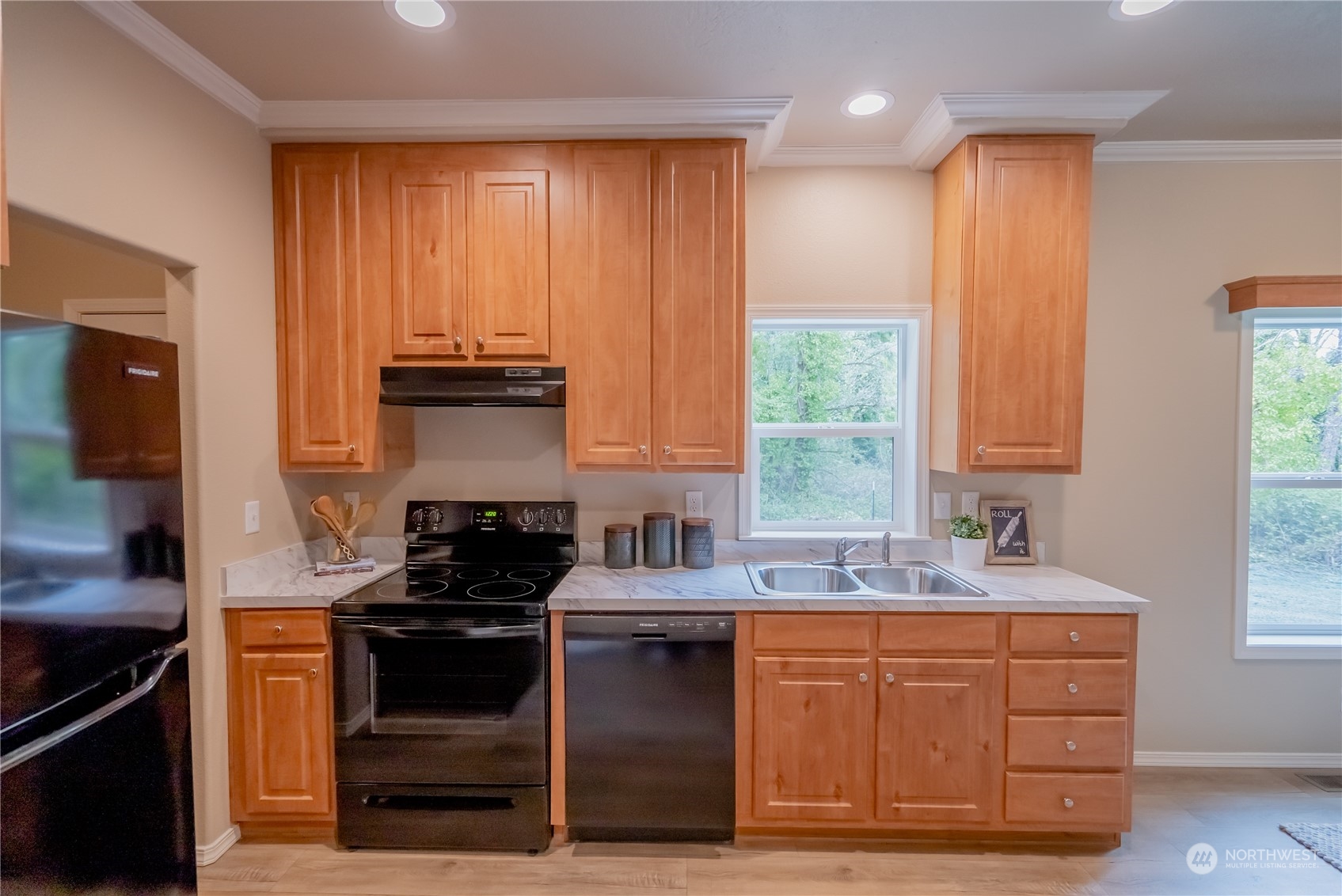 16819 Erickson Road Southwest Longbranch, WA 98351 - Photo 6 of 15 a kitchen with stainless steel appliances granite countertop a stove and a sink