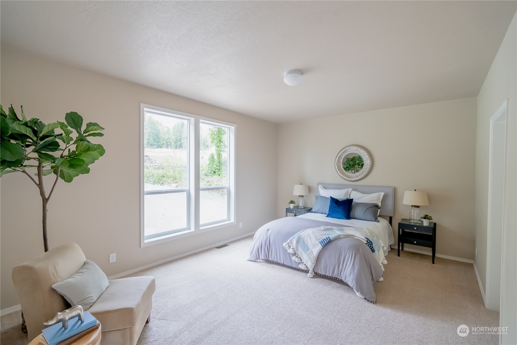 16819 Erickson Road Southwest Longbranch, WA 98351 - Photo 8 of 15 a bedroom with bed and a window