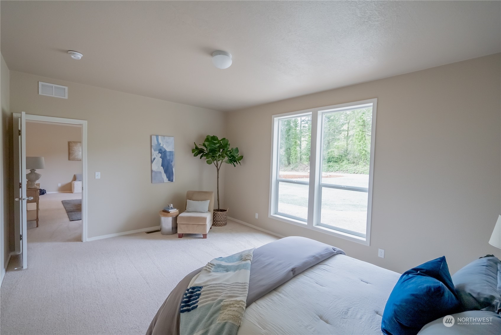 16819 Erickson Road Southwest Longbranch, WA 98351 - Photo 9 of 15 a bedroom with a bed and window