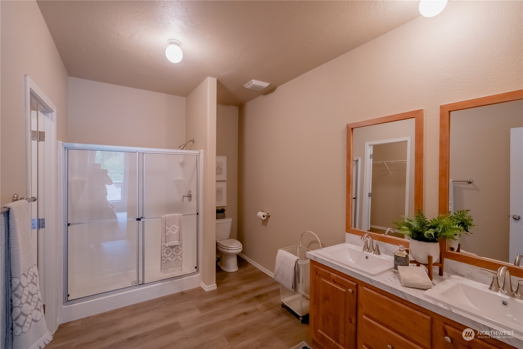 16819 Erickson Road Southwest Longbranch, WA 98351 - Photo 10 of 15 a bathroom with a sink a toilet and shower