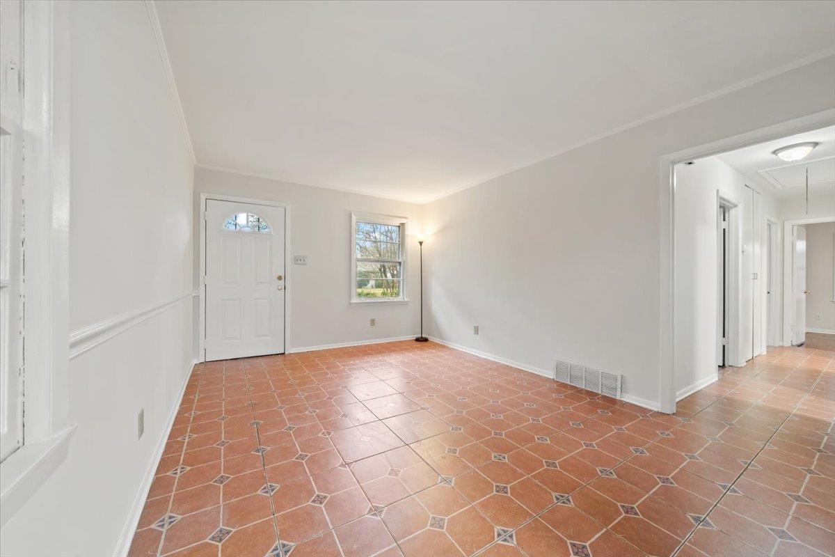 a view of an empty room and window