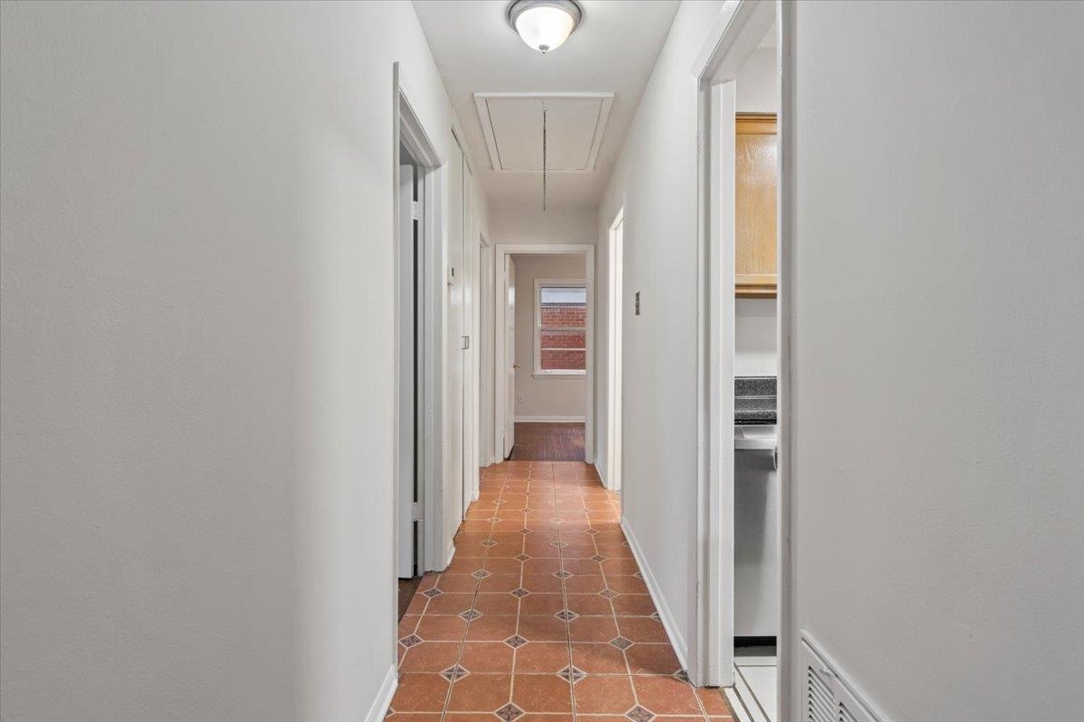 1554 Hopewell Road Memphis, TN 38117 - Photo 16 of 24 Hallway with attic access and light tile patterned floors