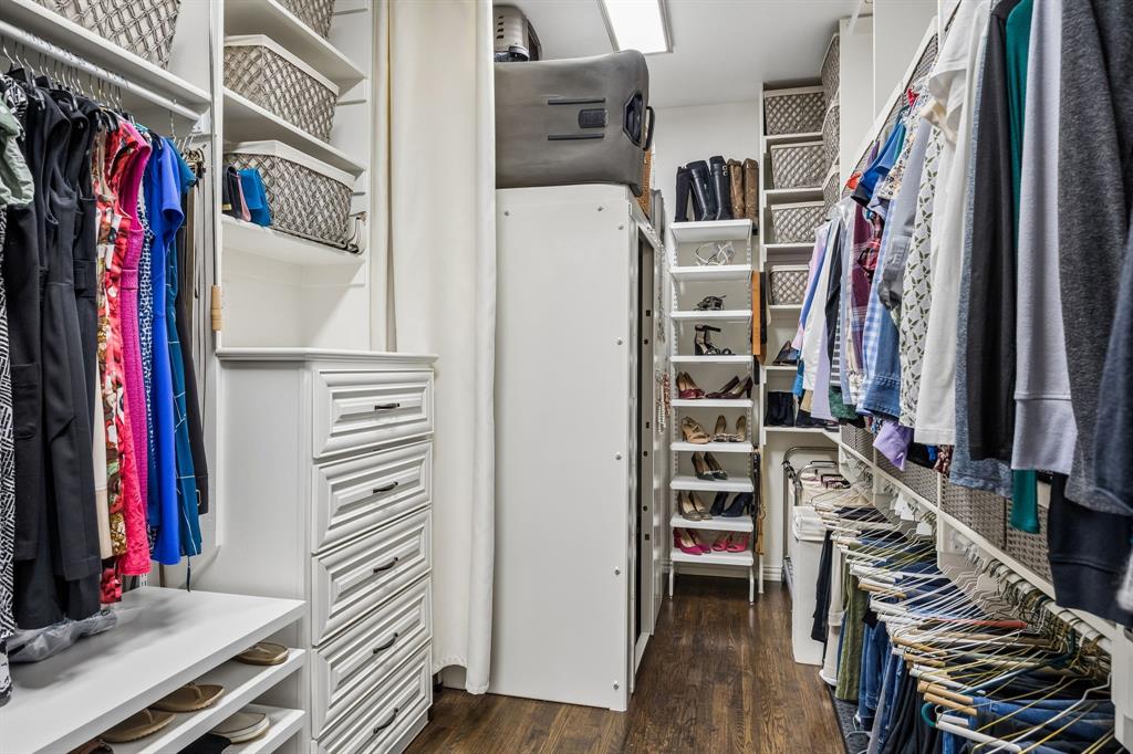 1005 Berkshire Road Southlake, TX 76092 - Photo 27 of 40 a view of walk in closet with clothes and shoes