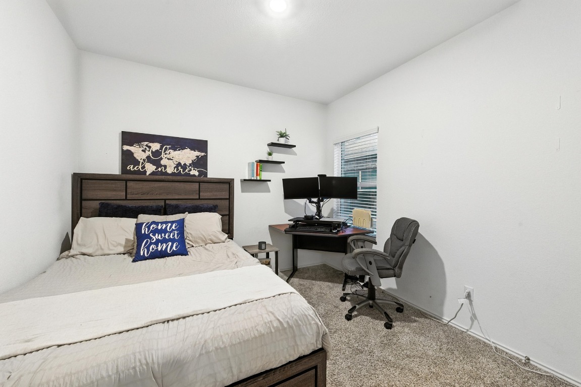 112 Cherry Ridge Road Georgetown, TX 78628 - Photo 20 of 35 a bedroom with a bed and furniture