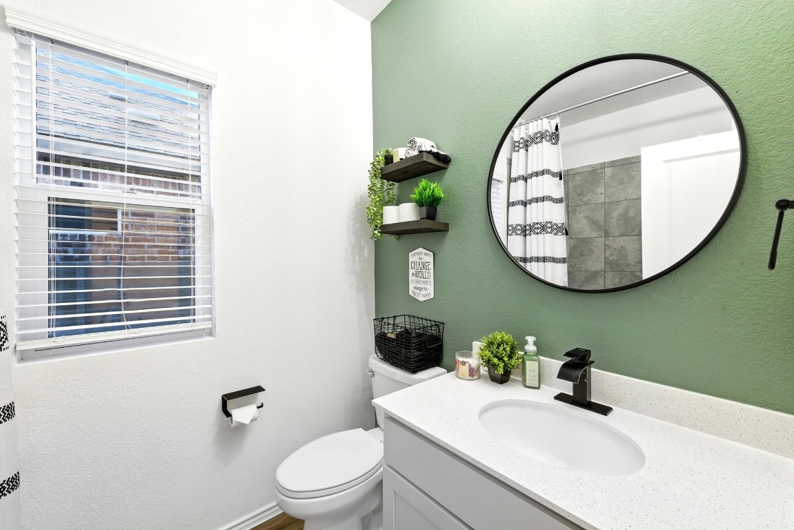112 Cherry Ridge Road Georgetown, TX 78628 - Photo 24 of 35 a bathroom with a sink and a mirror
