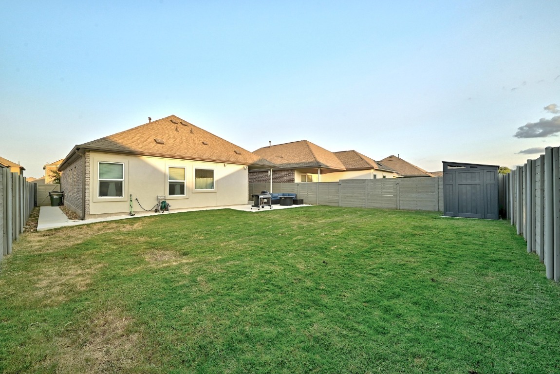 112 Cherry Ridge Road Georgetown, TX 78628 - Photo 27 of 35 a front view of a house with a garden