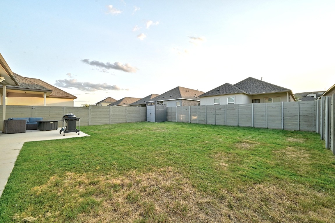 112 Cherry Ridge Road Georgetown, TX 78628 - Photo 28 of 35 a view of a house with a backyard