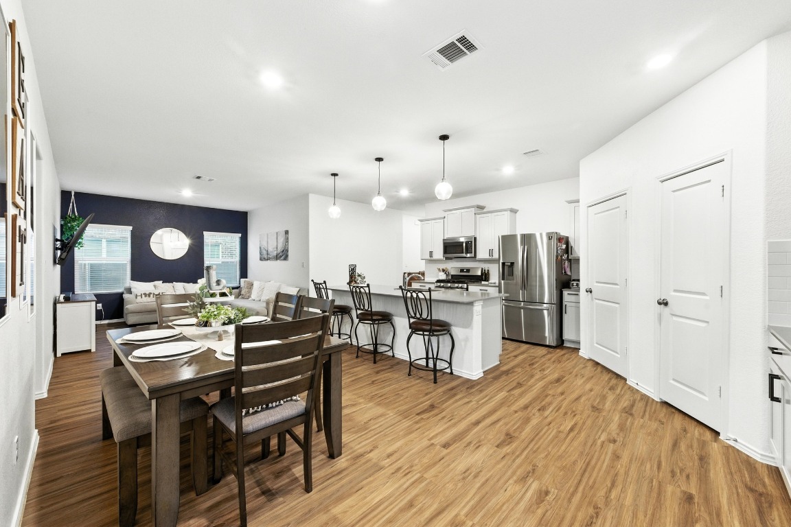 112 Cherry Ridge Road Georgetown, TX 78628 - Photo 6 of 35 Dining area with light wood finished floors and recessed lighting