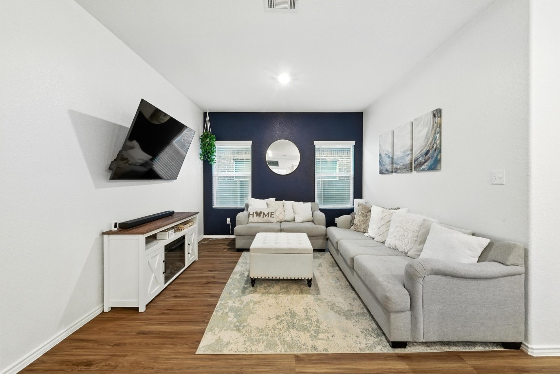 112 Cherry Ridge Road Georgetown, TX 78628 - Photo 8 of 35 a living room with furniture and a flat screen tv