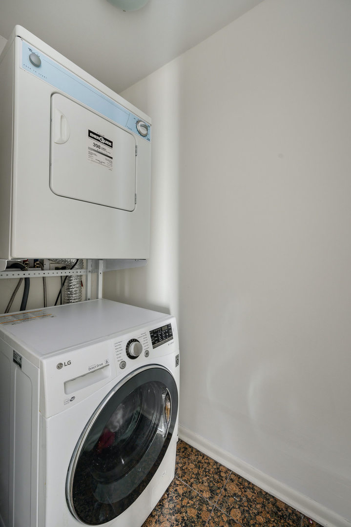 111 East Chestnut Street, Unit 37F Chicago, IL 60611 - Photo 14 of 23 a utility room with dryer and washer