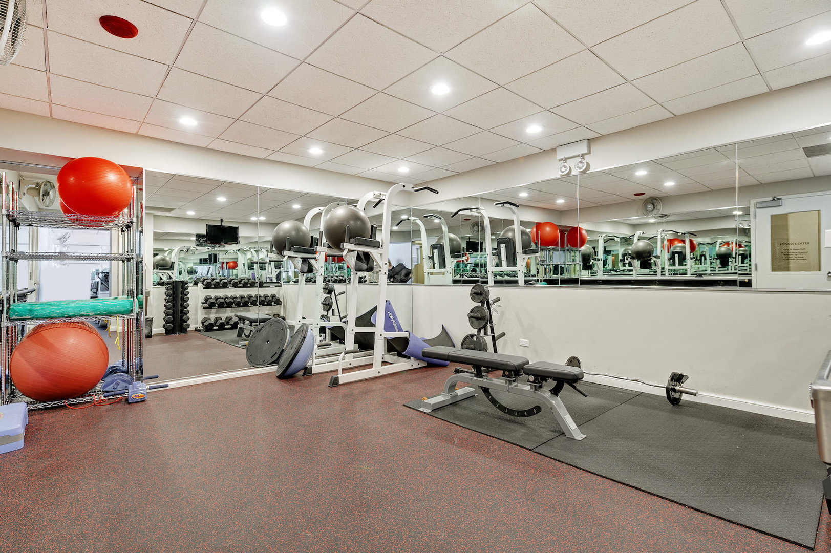 111 East Chestnut Street, Unit 37F Chicago, IL 60611 - Photo 20 of 23 a view of a room with gym equipment