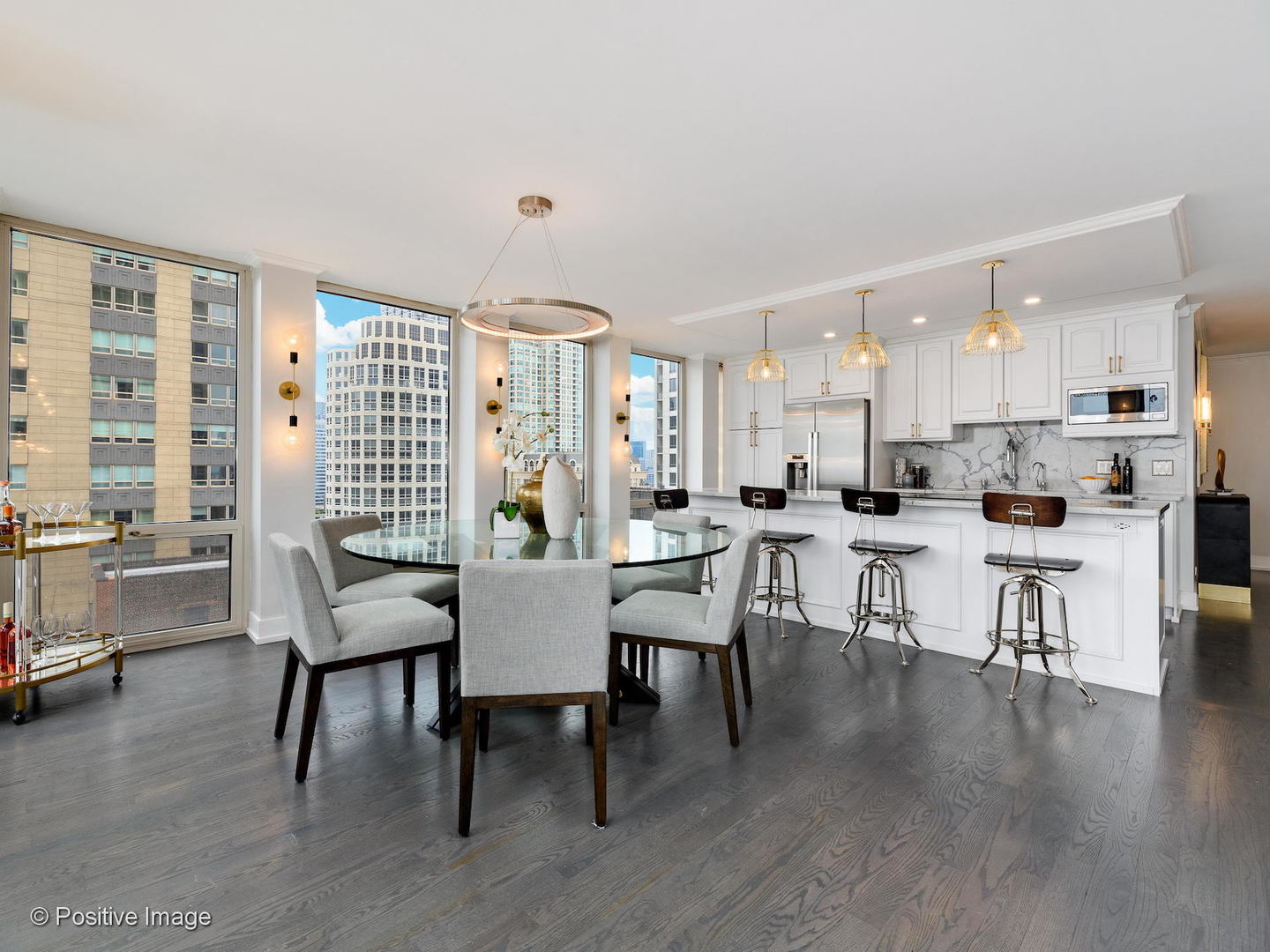 111 East Chestnut Street, Unit 37F Chicago, IL 60611 - Photo 23 of 23 a view of a dining room with furniture and wooden floor