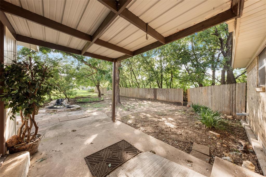 413 Texas Avenue Hewitt, TX 76643 - Photo 23 of 26 Fenced backyard with a patio area