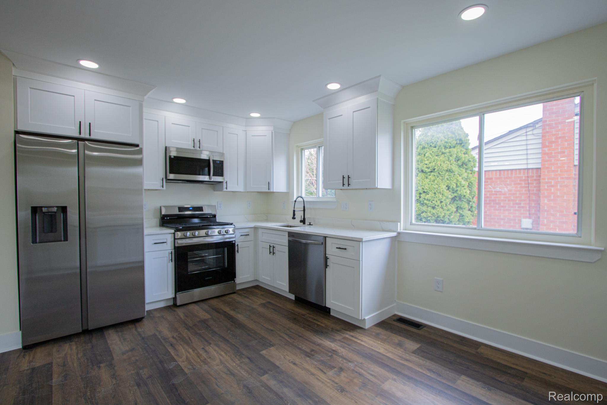 31000 Fall Fraser, MI 48026 - Photo 10 of 28 Kitchen featuring stainless steel appliances, white cabinetry, dark wood-style floors, and recessed lighting