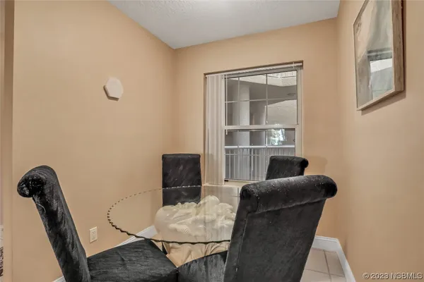 a work room with furniture and a window
