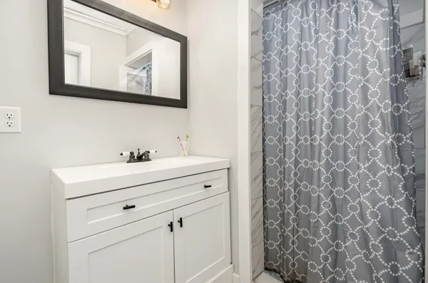 a view of bathroom with shower curtain