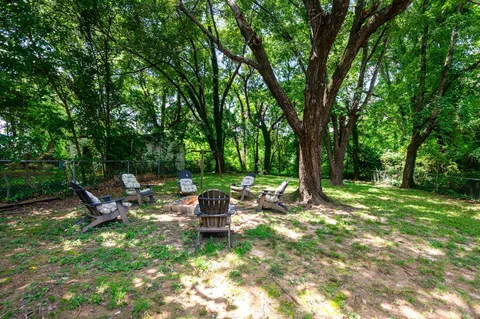 a view of a chairs in a backyard