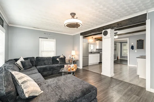 a living room with furniture and a large window