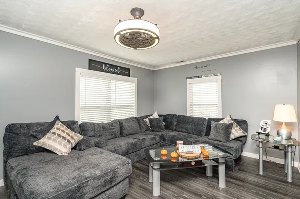 a living room with furniture and a large window