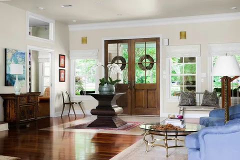 a living room with furniture and a large window
