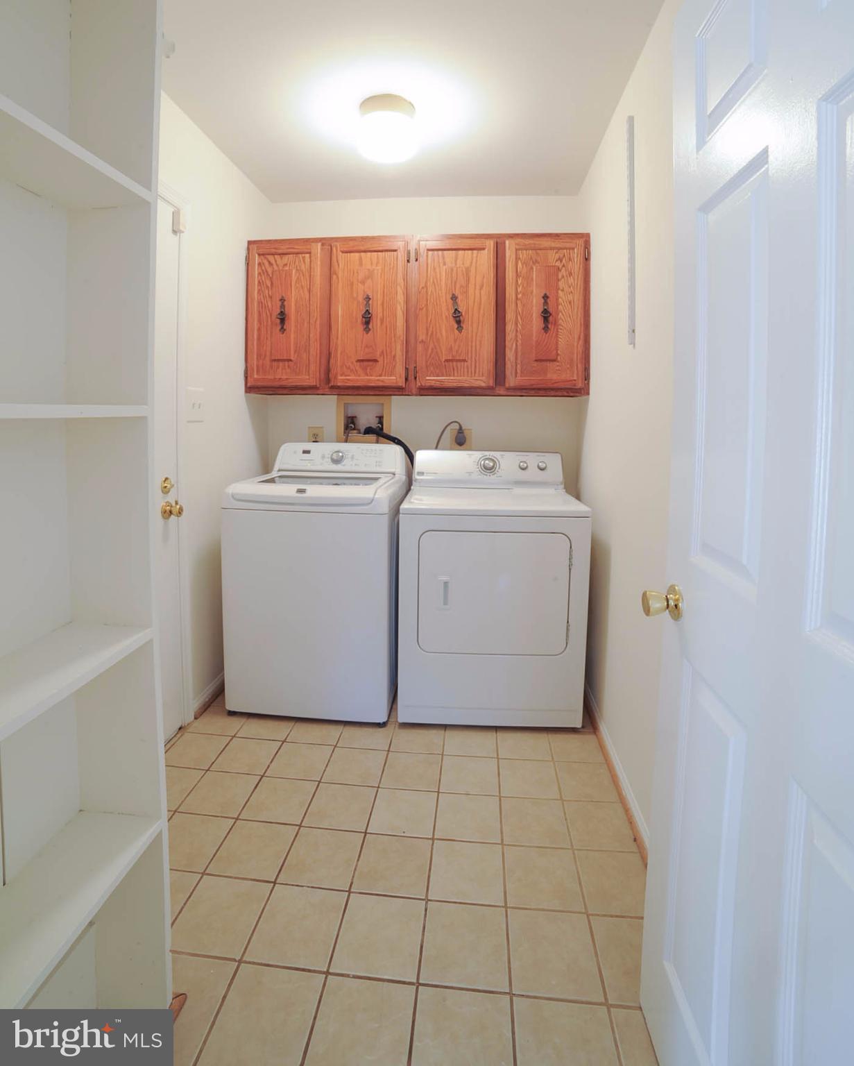 8303 Lindside Way Springfield, VA 22153 - Photo 12 of 30 Laundry room. Door to garage on the left of washer