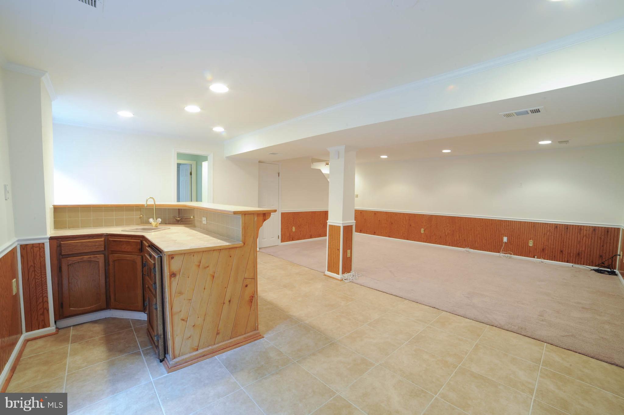 8303 Lindside Way Springfield, VA 22153 - Photo 25 of 30 Basement with full bar area