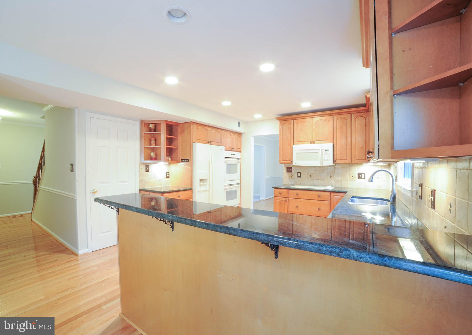 8303 Lindside Way Springfield, VA 22153 - Photo 9 of 30 Kitchen view with bar