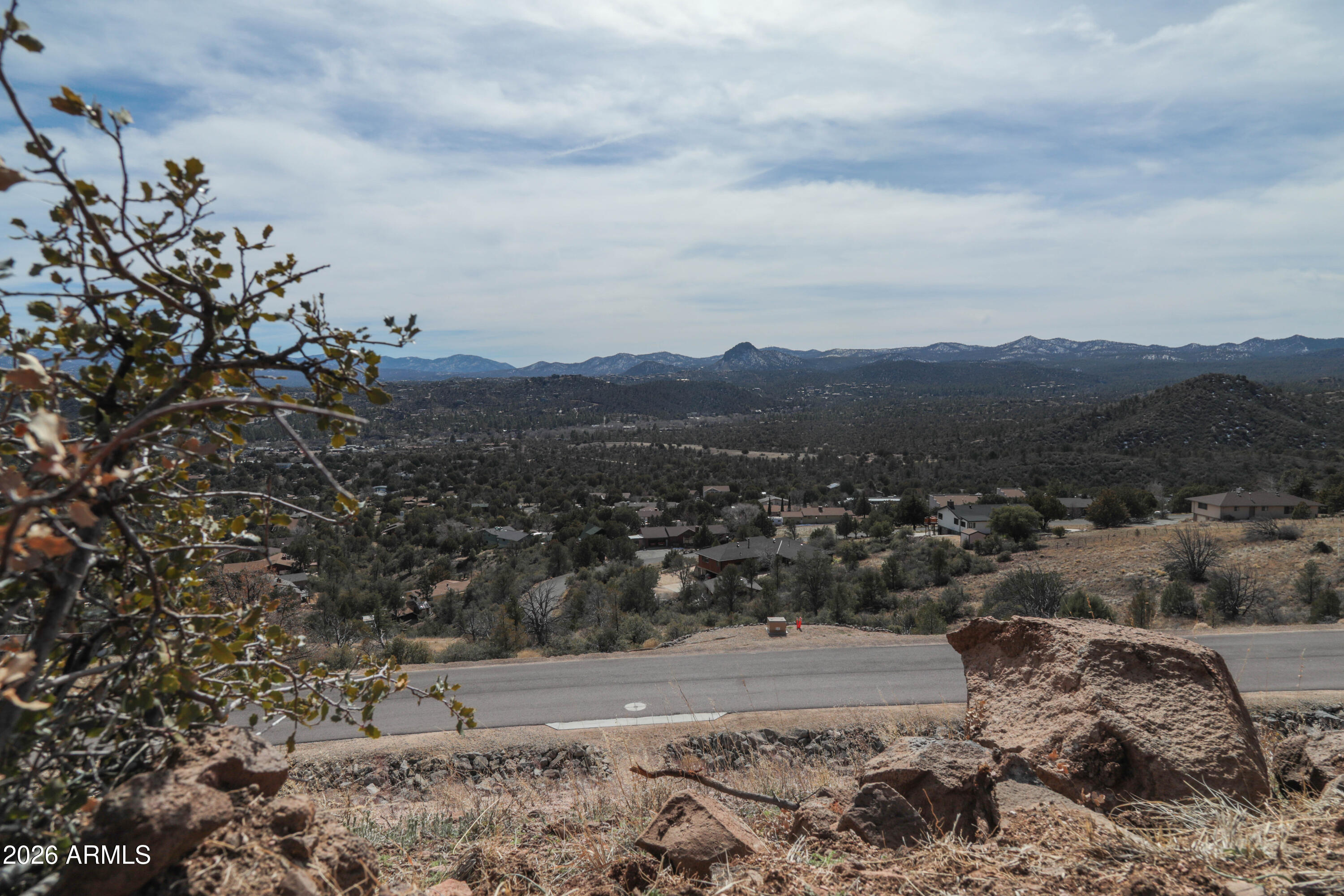 2588 West Black Ridge Trail, Unit 30 Prescott, AZ 86305 - Photo 16 of 32 a view of a yard with a mountain