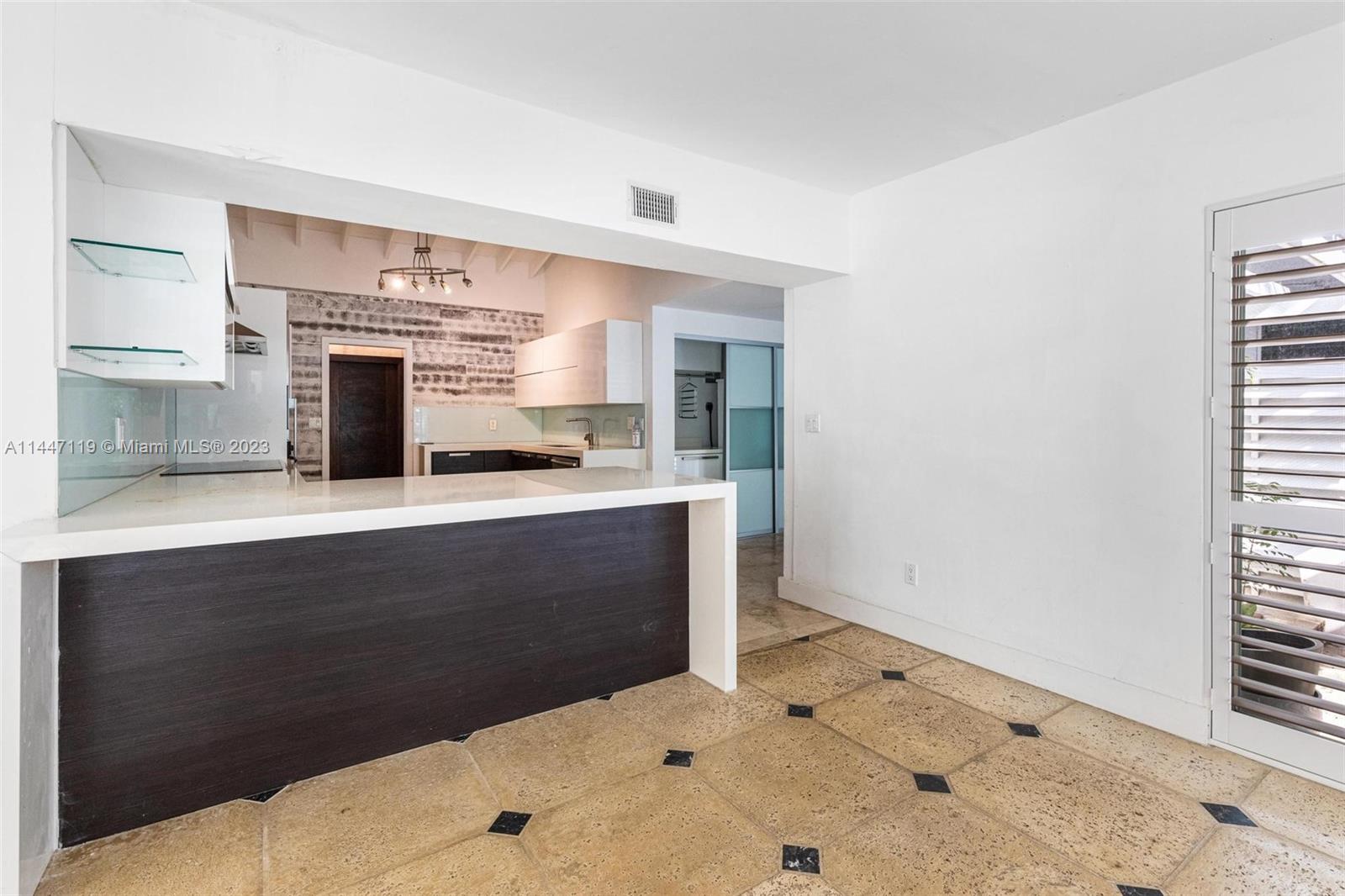 325 Gulf Road Key Biscayne, FL 33149 - Photo 5 of 20 a bathroom with a sink and a mirror