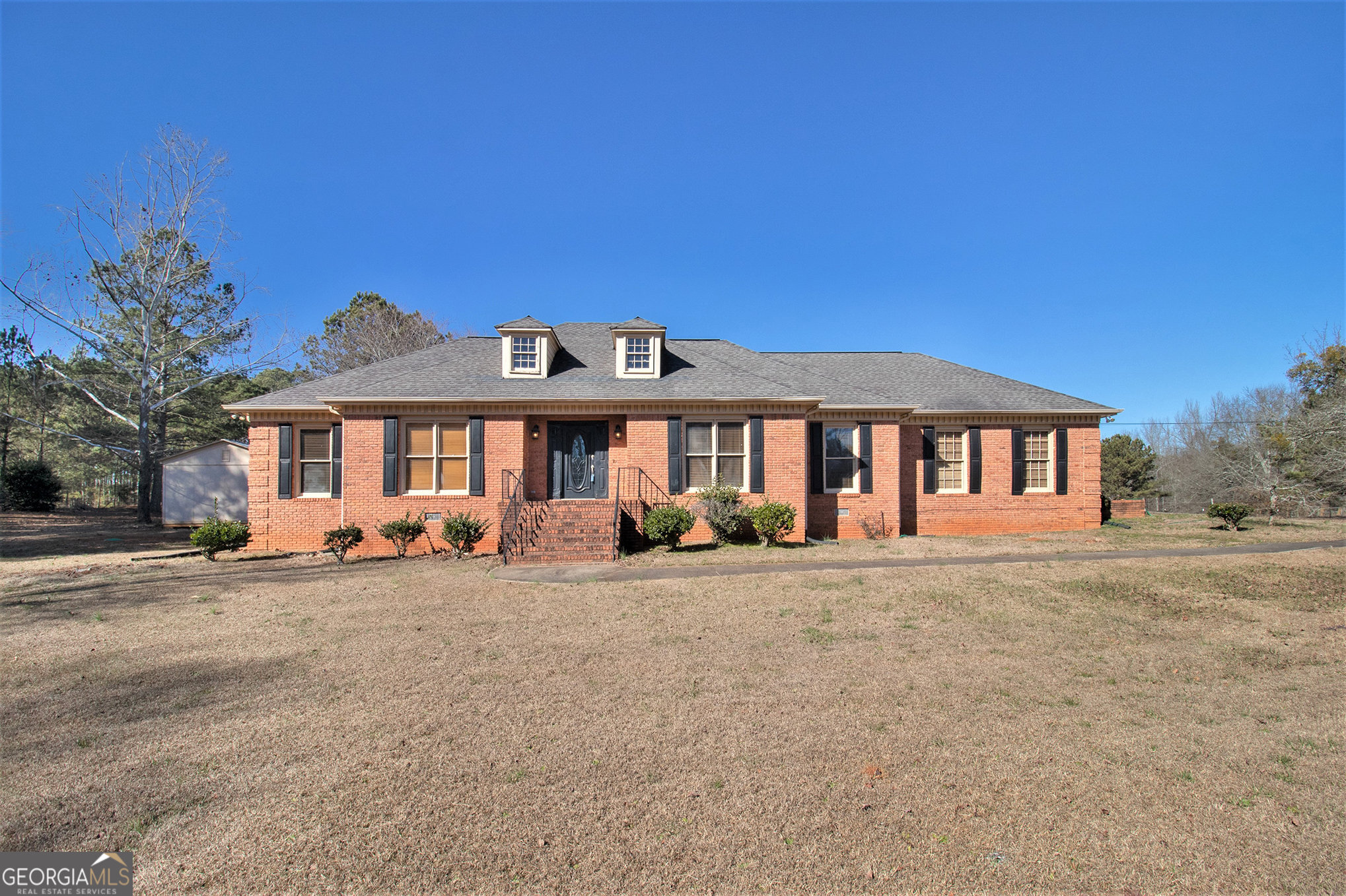 a front view of a house with a yard