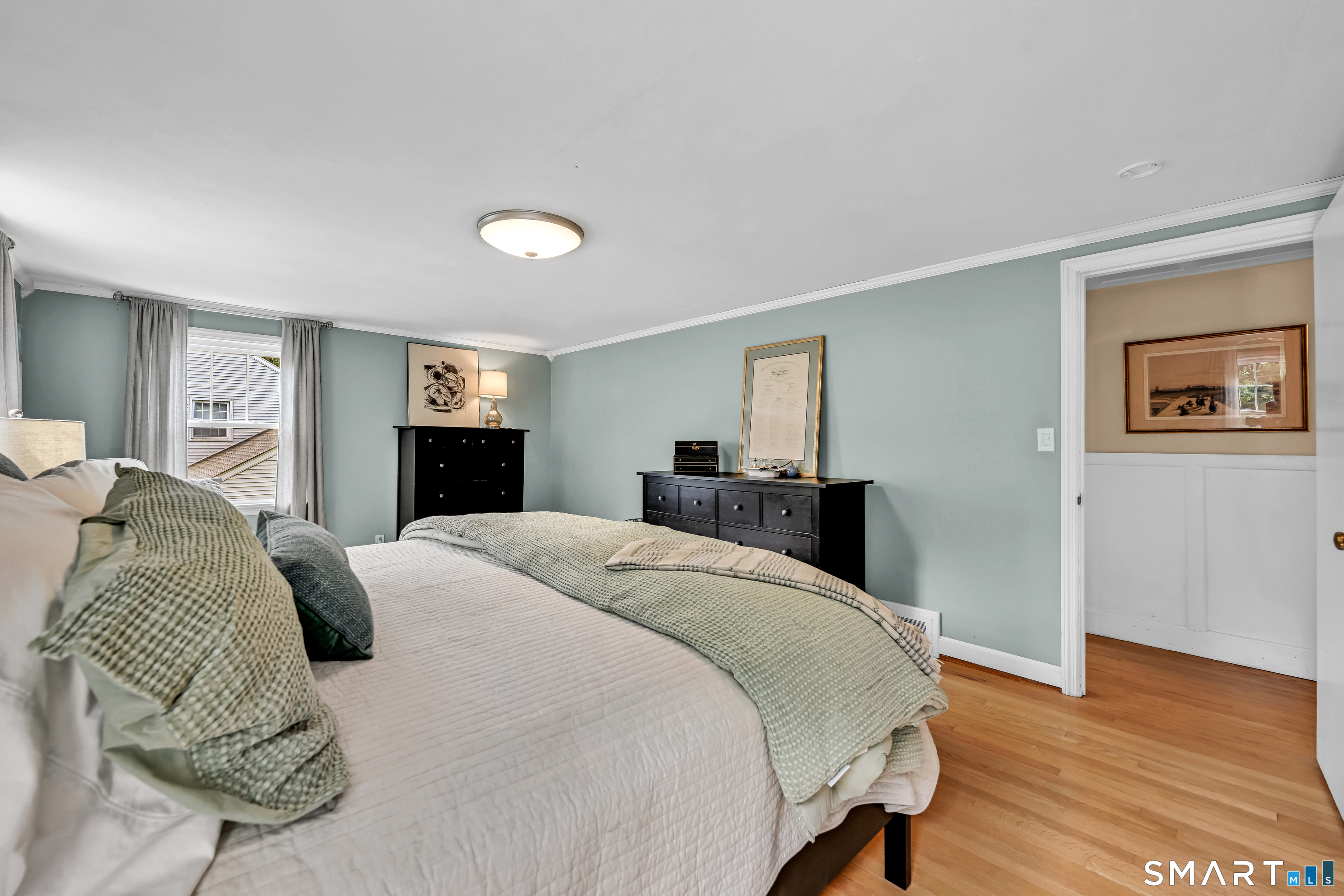 47 Spring Lane West Hartford, CT 06107 - Photo 31 of 38 a bedroom with a bed and wooden floor