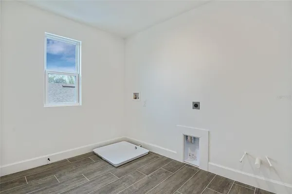 a room with a bench and vanity